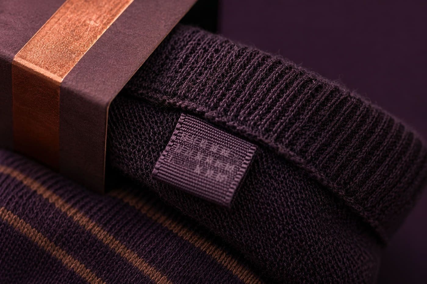 A woven fibre composition label inside a sock cuff